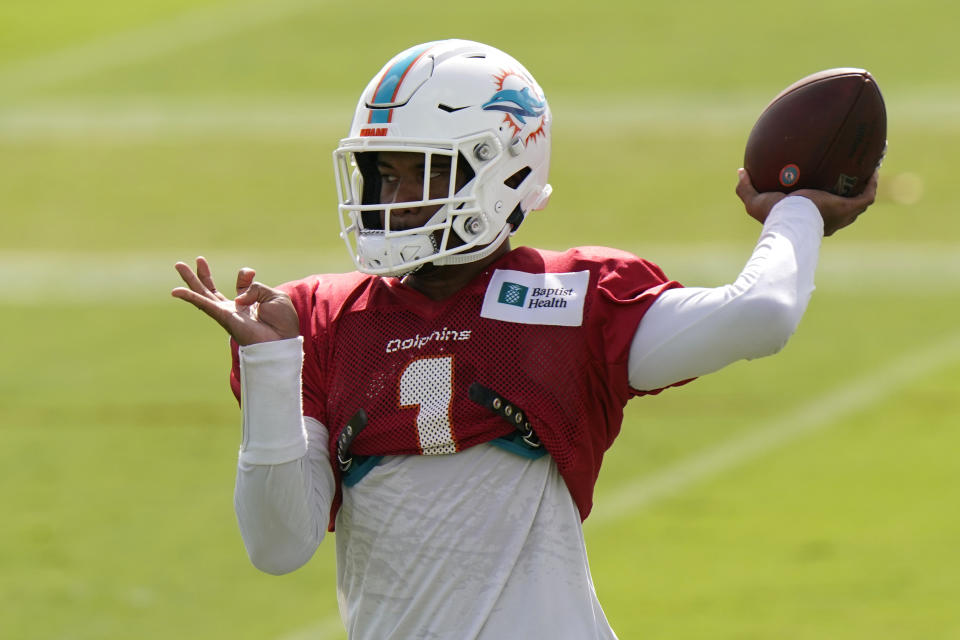 FILE - In this Aug. 25, 2020, file photo, Miami Dolphins quarterback Tua Tagovailoa does drills during practice at the NFL football team's training facility in Davie, Fla. When asked Monday, Oct. 5, 2020, about the Dolphins' quarterback situation, coach Brian Flores paused for eight seconds he answered. That was plenty of time to stir up even more speculation regarding when top draft pick Tagovailoa might make his NFL debut. (AP Photo/Lynne Sladky, File)