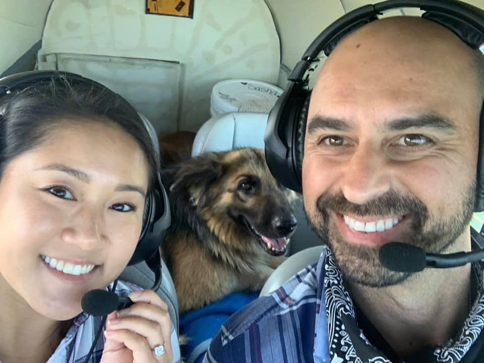 Debbie Li and Eduard Seitan smile in the cockpit during a Pilots N Paws mission. (Courtesy of Eduard Seitan)
