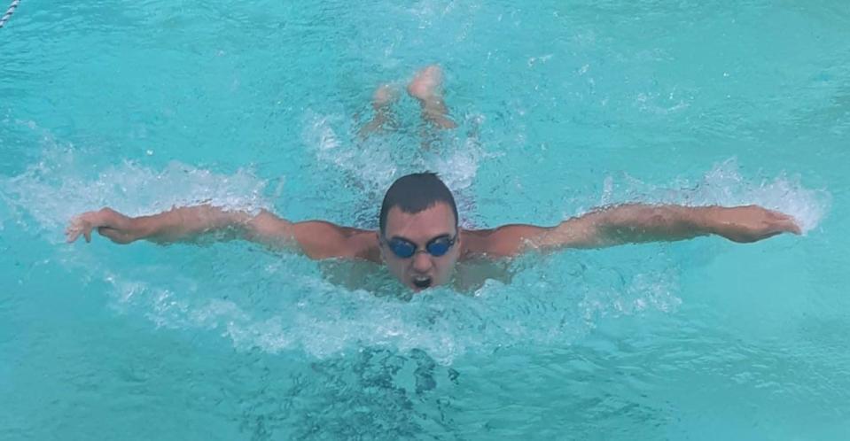 Zachary Brown practices his butterfly stroke at Wood-Dale Swim Club in Hopewell.