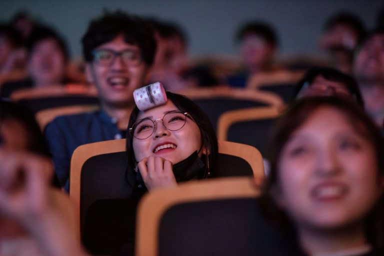 Spectators watch as professional eSports teams 'Griffin' and 'Afreeca Freaks' prepare to compete in a 'League of Legends' competition, in Seoul, on July 11, 2018