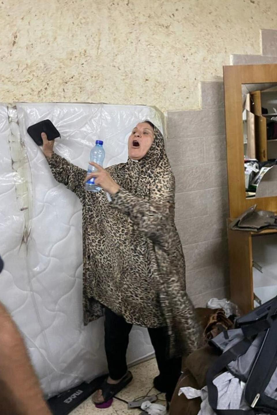 Adam Nasser Abu Alwahais’s mother, Maryam, in her house after the raid (Kim Sengupta/The Independent)