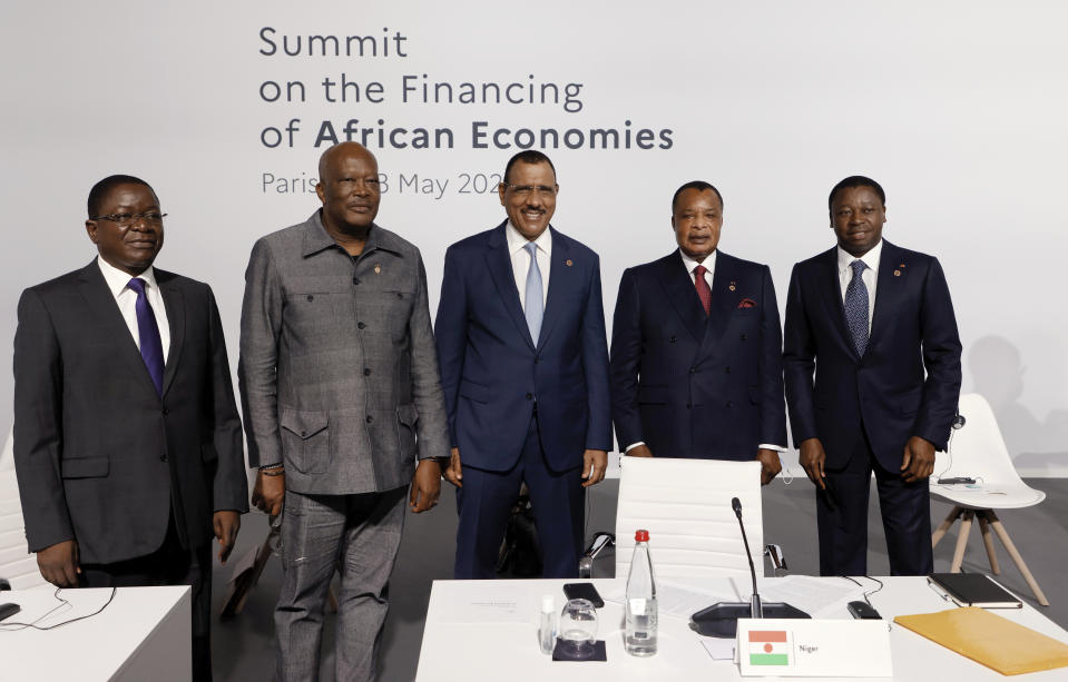 From the left, Chad's Prime Minister Albert Pahimi Padacke, Burkina Faso's President Roch Marc Christian Kabore, Niger's President Mohamed Bazoum, the President of the Republic of Congo Denis Sassou Nguesso, and Togo's President Faure Gnassingbe, pose before the opening session at the Summit on the Financing of African Economies Tuesday, May 18, 2021 in Paris. More than twenty heads of state and government from Africa are holding talks in Paris with heads of international organizations on how to revive the economy of the continent, deeply impacted by the consequences of the COVID-19 pandemic. (Photo by Ludovic Marin, Pool via AP)