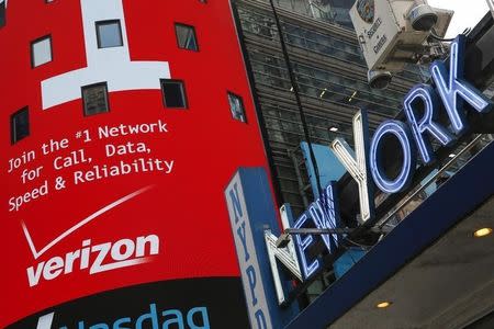 An advertisement for Verizon is seen at Times Square in New York, May 12, 2015. REUTERS/Shannon Stapleton