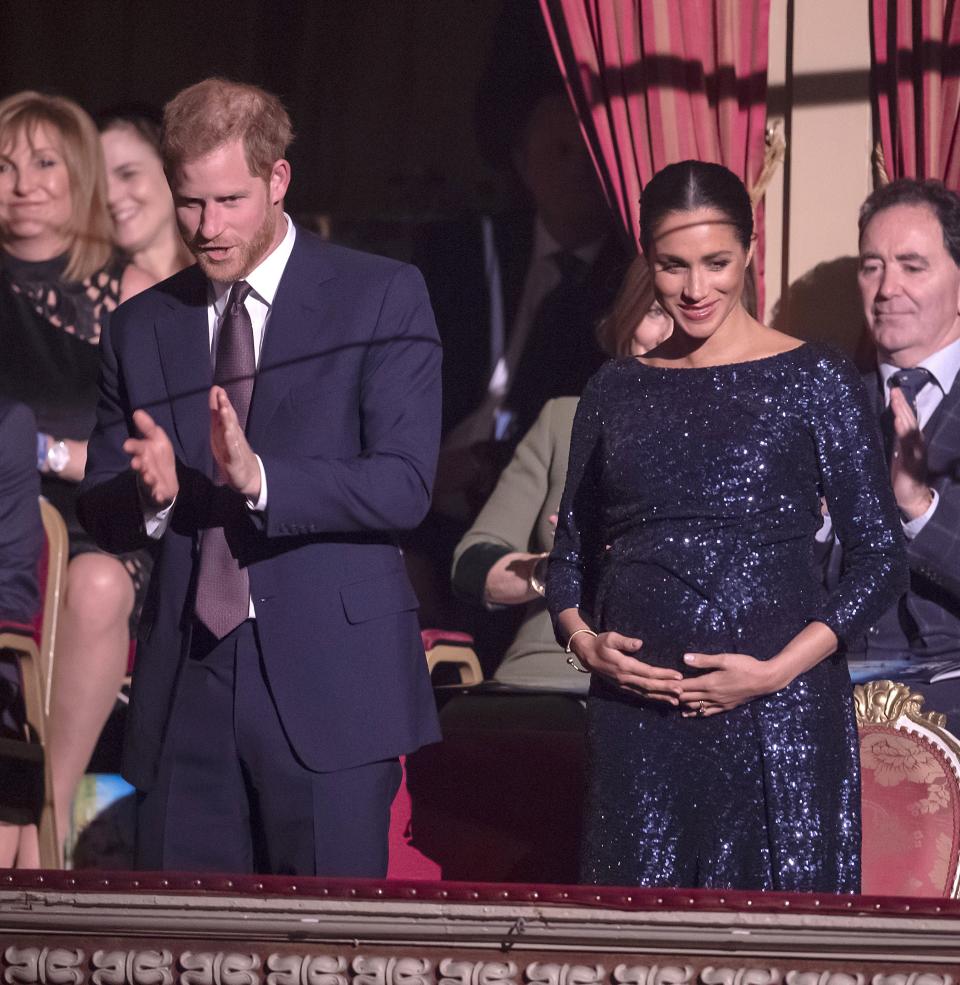 Duchess Meghan stunned at a gala in a slinky blue gown and one of Princess Diana's bracelets. Earlier, she laughed when a fan called her a 'fat lady.'