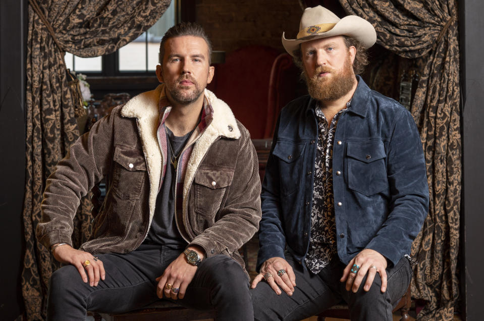 T.J. Osborne, left, and John Osborne, of Brothers Osbourne, pose for a portrait on Thursday, Nov. 4, 2021, in Nashville, Tenn. The brother duo are up for three CMA awards, including album of the year for “Skeletons." (Photo by Ed Rode/Invision/AP)