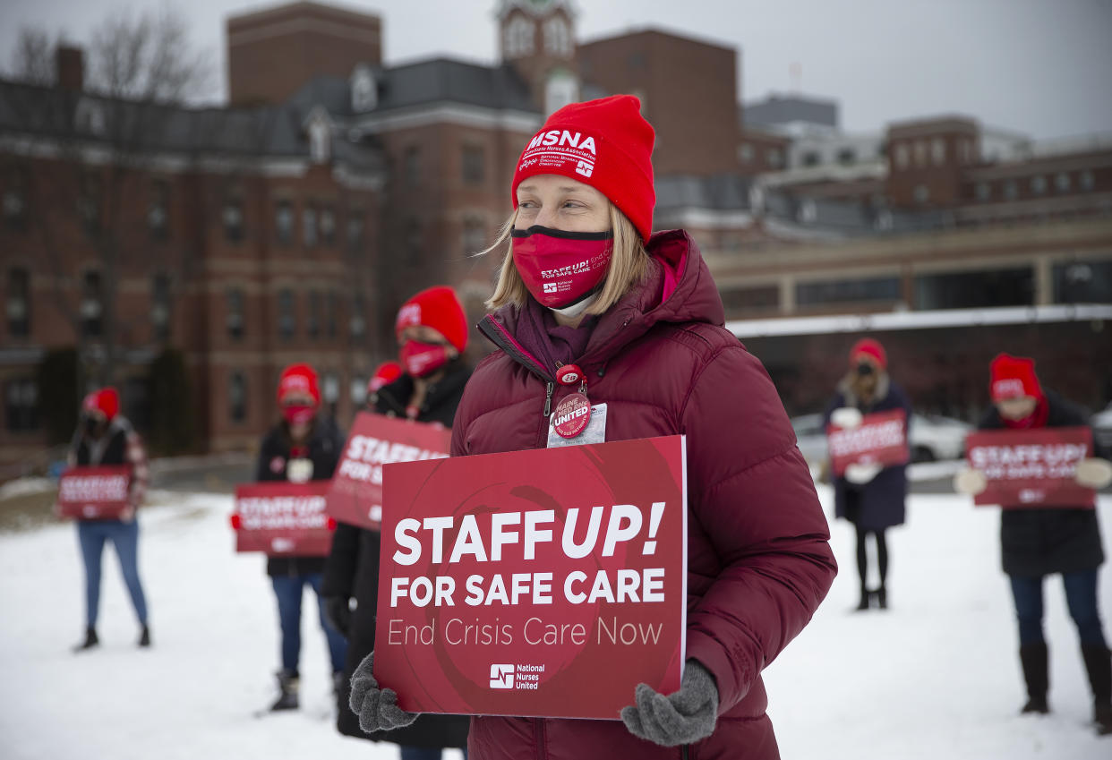 Amy Downer, an operating room nurse at Maine Medical Center joins fellow nurses to demand increased protections in their work environments. (Photo by Derek Davis/Portland Press Herald via Getty Images)