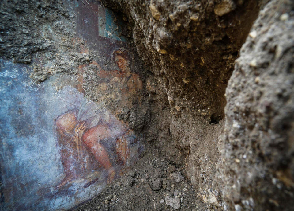 CORRECTS TITLE OF THE FIGURE SHOWN IN THE FRESCO, FROM GODDESS TO QUEEN OF SPARTA - The fresco ''Leda e il cigno'' (Leda and the swan) discovered last Friday in the Regio V archeological area in Pompeii, near Naples, Italy, is seen Monday, Nov. 19, 2018. The fresco depicts a story and art subject of Greek mythology, with Queen of Sparta Leda being impregnated by Zeus - Jupiter in Roman mythology - in the form of a swan. (Cesare Abbate/ANSA via AP)