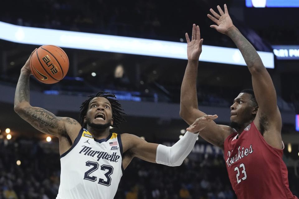 Marquette's David Joplin shoots past Northern Illinois's Harvin Ibarguen during the first half of an NCAA college basketball game Monday, Nov. 6, 2023, in Milwaukee. (AP Photo/Morry Gash)