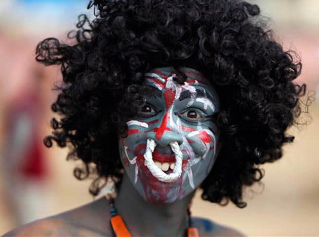 A Hindu devotee dressed as a demon participates in a procession on the eve of Shivratri festival, in Jammu, India, Tuesday, March 1, 2011. Shivratri, a festival dedicated to the worship of Hindu God Shiva, will be marked across the country Wednesday. (AP Photo/Channi Anand)