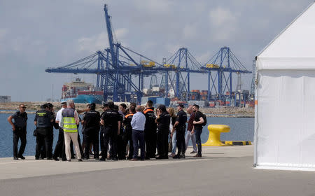 Police and Civil Guard staff hold a briefing next to the point of arrival of refugee vessel Aquarius and two other Italian ships expected tomorrow at the port of Valencia, Spain, June 16, 2018. REUTERS/Heino Kalis