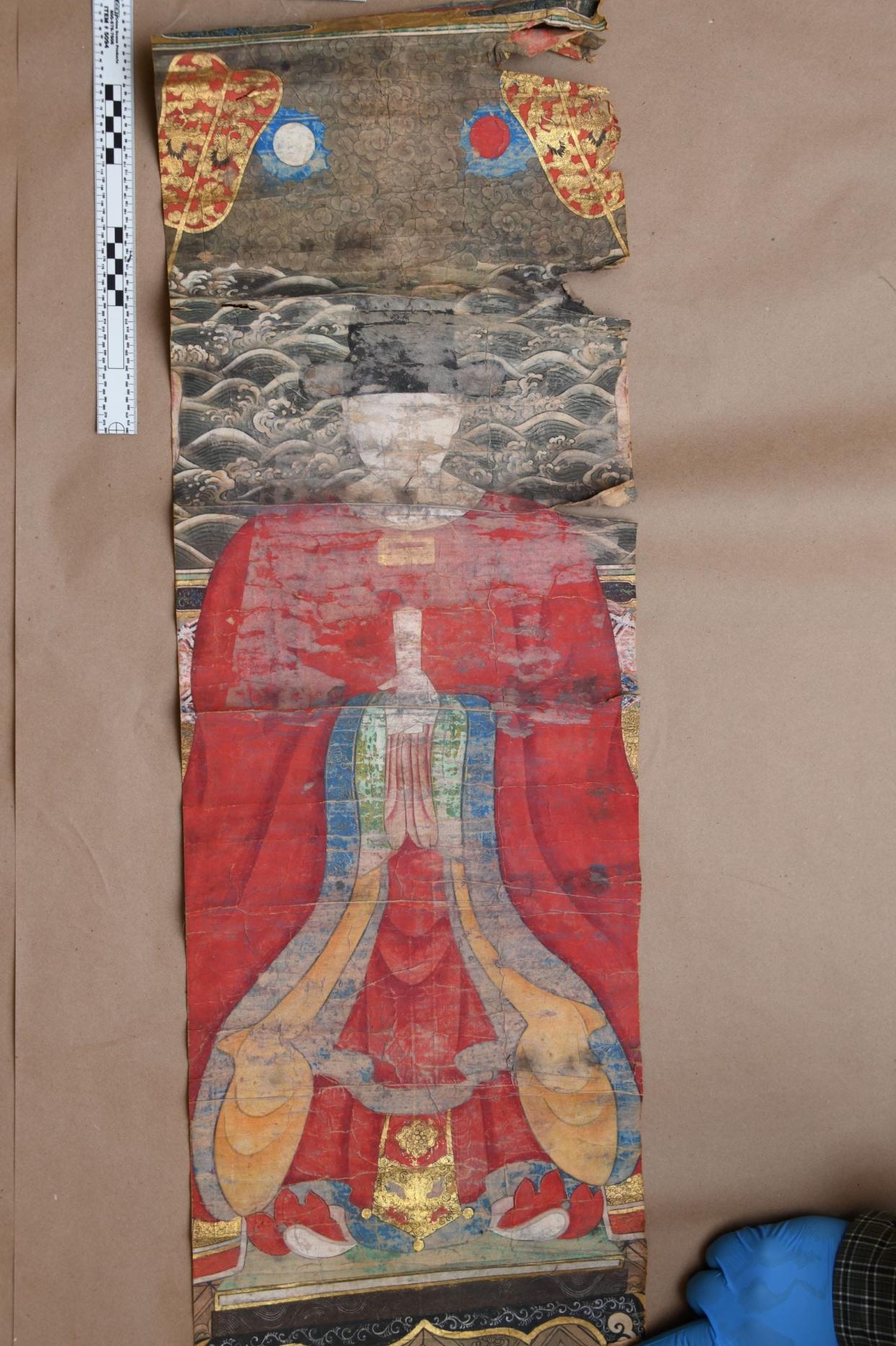 Pictured is one  of six painted scrolls from the 18th-19th centuries that were found in the attic of a WWII veteran who died in 2023. The FBI believes that three of them were originally one piece before they were divided.