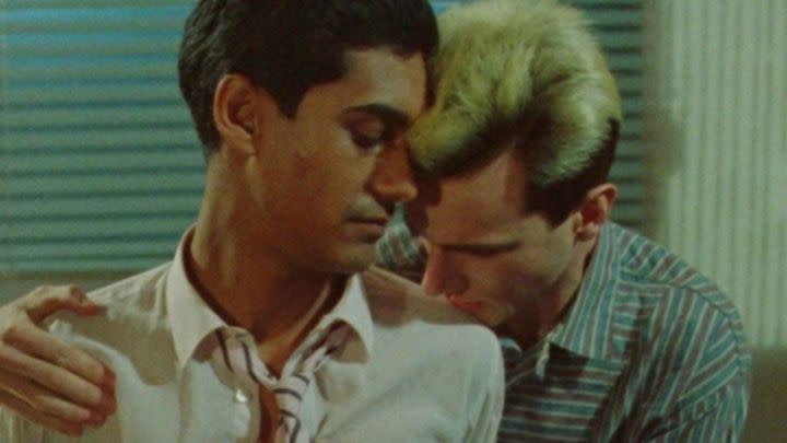 Johnny resting his chin on Omar's shoulder in My Beautiful Laundrette.