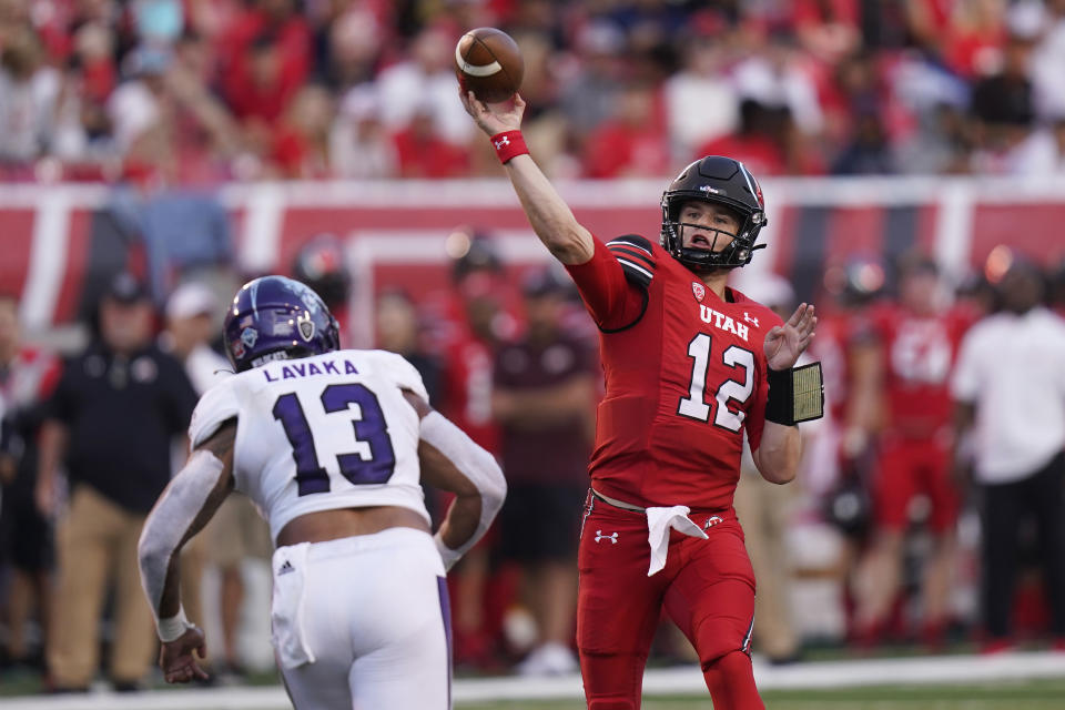 Utah quarterback Charlie Brewer (12) throws a pass as Weber State linebacker Sherwin Lavaka (13) defends during the first half of an NCAA college football game Thursday, Sept. 2, 2021, in Salt Lake City. (AP Photo/Rick Bowmer)