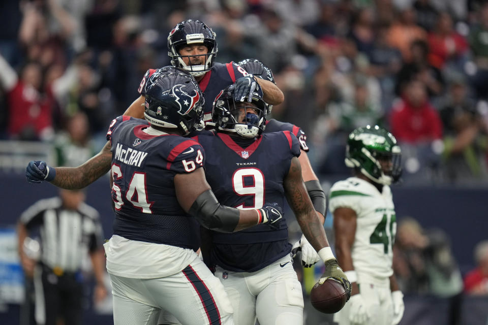 Houston Texans tight end Brevin Jordan (9) celebrates his touchdown with center Justin McCray (64) in the first half of an NFL football game against the New York Jets in Houston, Sunday, Nov. 28, 2021. (AP Photo/Eric Smith)