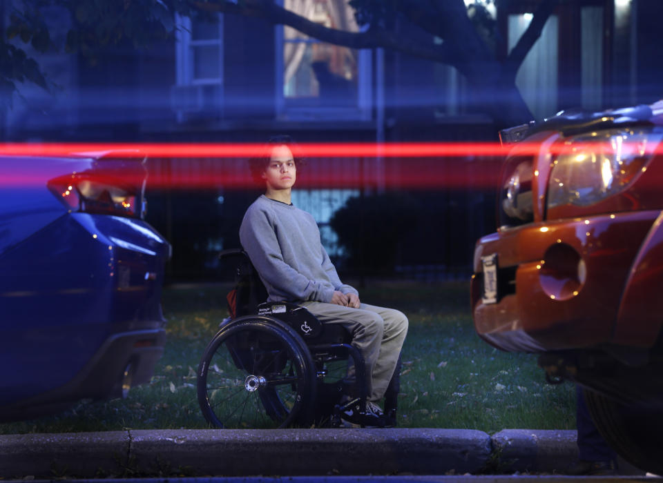 FILE - Jonathan Annicks poses for a portrait with his wheelchair in front of his home in Chicago on Oct. 13, 2016, just a few feet from where a lone gunman shot him, leaving him paralyzed sitting in his brother's parked car. Six years later Annicks has received a bachelor's degree in communications and media and has become a part-time peer advisor for patients at the same rehabilitation hospital where he was a patient. (AP Photo/Charles Rex Arbogast, File)