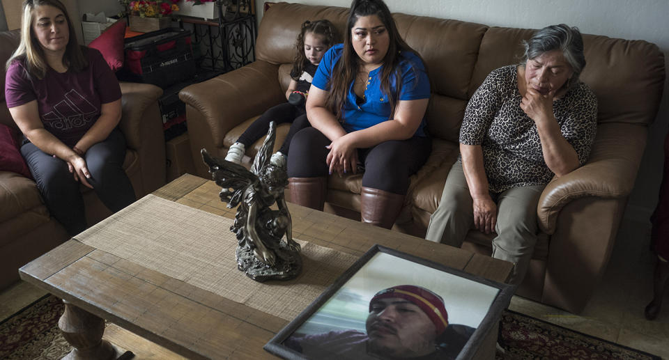 Family members of Jerry Ramos become emotional when looking at a photo of him at the family home. Source: AP