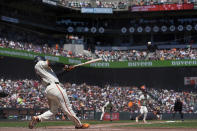 San Francisco Giants' LaMonte Wade Jr. hits a sacrifice fly against the Pittsburgh Pirates during the third inning of a baseball game Sunday, April 28, 2024, in San Francisco. (AP Photo/Godofredo A. Vásquez)