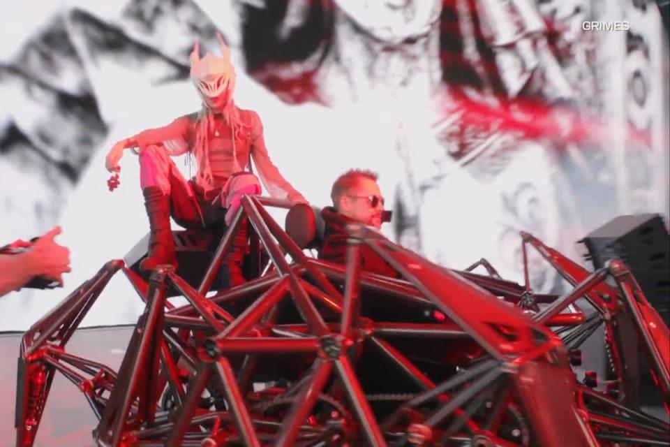 Grimes arriving onstage at Coachella atop a spider-like robotic vehicle (YouTube)