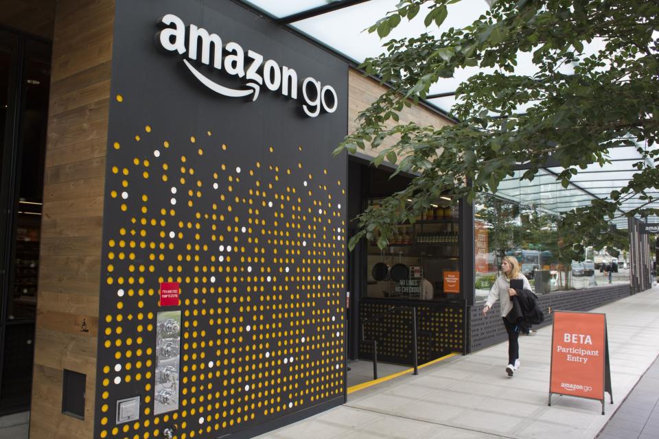 A woman walks past the Amazon Go grocery store at the Amazon corporate headquarters on June 16, 2017 in Seattle, Washington. (David Ryder/Getty Images)