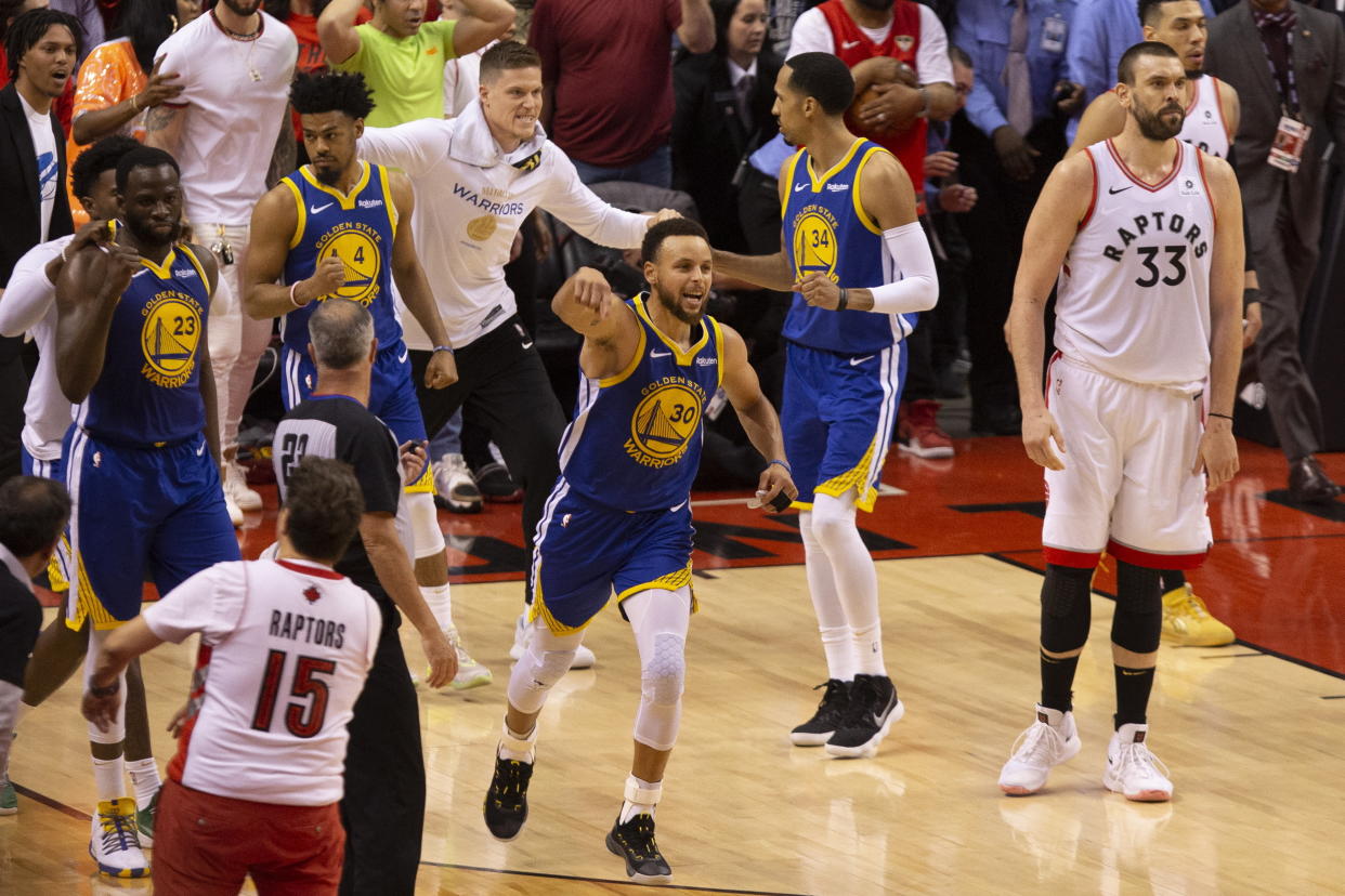 Golden State Warriors' Stephen Curry (30) celebrates at the final buzzer as his team defeated the Toronto Raptors 106-105 in Game 5 of the NBA Finals in Toronto on Monday June 10, 2019. (Chris Young/The Canadian Press via AP)