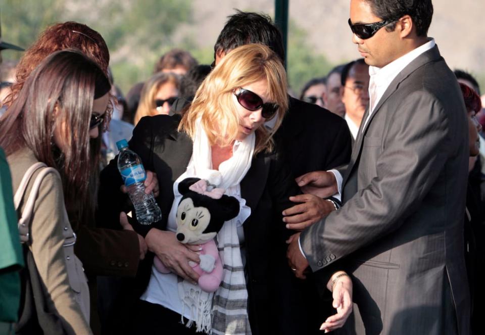 <div class="inline-image__caption"><p>Stephany Flores’ brother comforts their mother Marielena Ramirez at her funeral in Lima, June 3, 2010.</p></div> <div class="inline-image__credit">Mariana Bazo/Reuters</div>