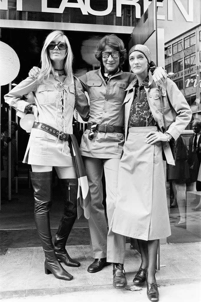 <p>Yves Saint Laurent with his muses Loulou and Betty Catrou. This photo blessed us with endless style pointers, including over-the-knee boots, the lace-up shirtdress, and the right way to pull off a safari jacket. <br></p>