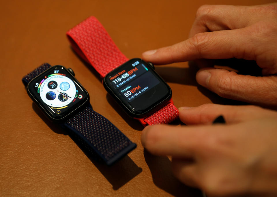 An Apple employee shows the features of the new Apple Watch Series 4 at the Apple Store in Singapore September 21, 2018. REUTERS/Edgar Su