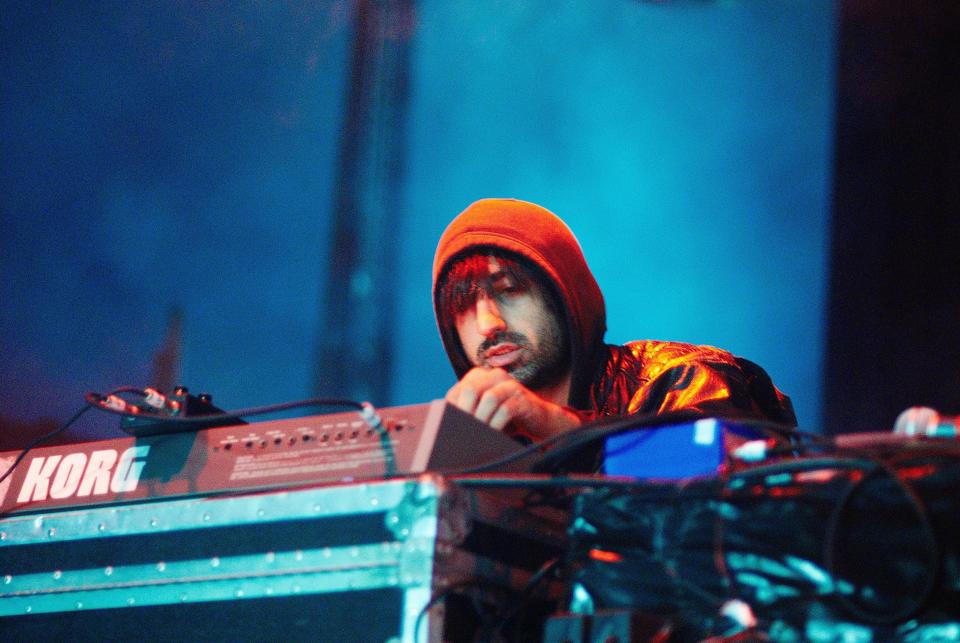 Ethan Kath performing on stage in 2008.