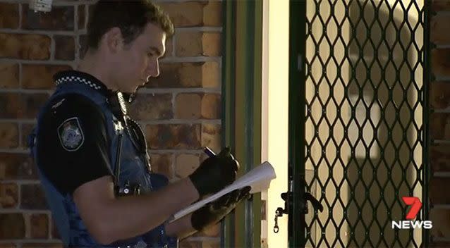 Police at the home of the woman who was stabbed by her ex-partner. Source: 7 News