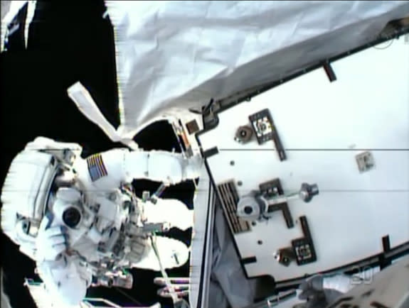 NASA astronaut Tom Marshburn snaps a photo of crewmate Chris Cassidy during a May 11, 2013 spacewalk in this view from Cassidy's helmet camera. The spacewalkers replaced an ammonia pump box while seeking a coolant leak outside the International