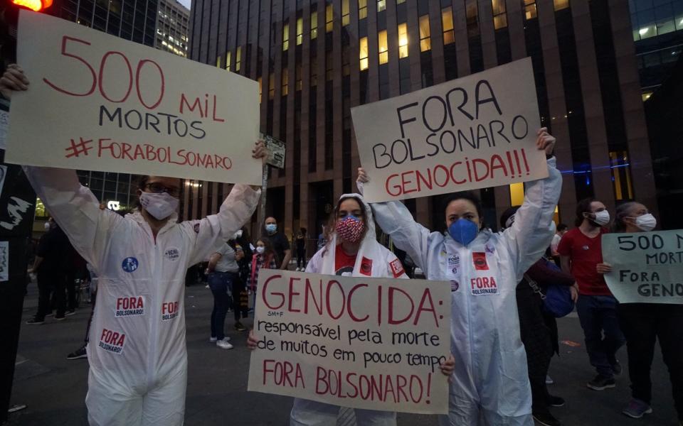 Anti-government protesters took to the streets in cities across Brazil on Saturday as the nation's confirmed death toll soared past half a million - a tragedy many critics blame on President Jair Bolsonaro - Cristina Szucinski/Anadolu Agency