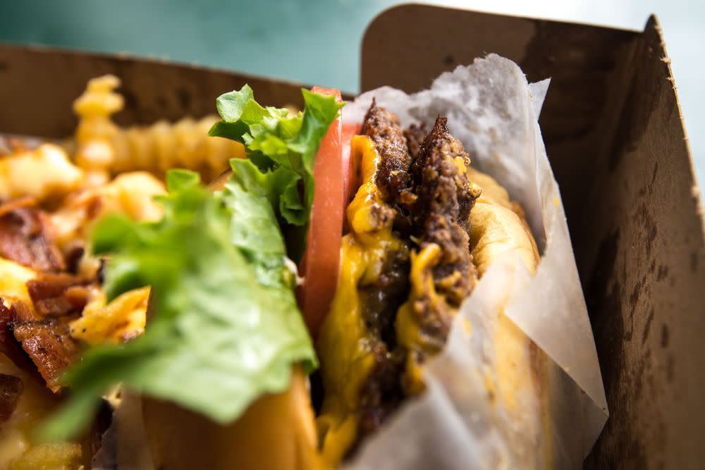 Closeup of Shake Shack burger with fries in a tray.