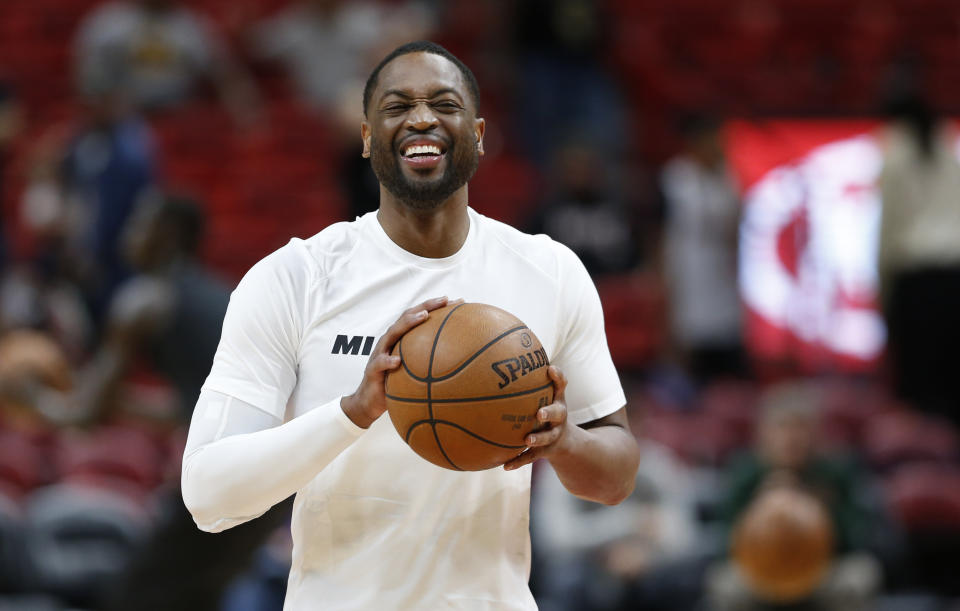 Miami Heat guard Dwyane Wade smiles as he warms up for the team’s game against the Milwaukee Bucks (AP Photo)