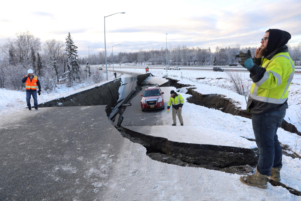 A stranded vehicle lies on a collapsed roadway near the airport after an earthquake in Anchorage, Alaska, Nov. 30, 2018. (Photo: Nathaniel Wilder/Reuters)