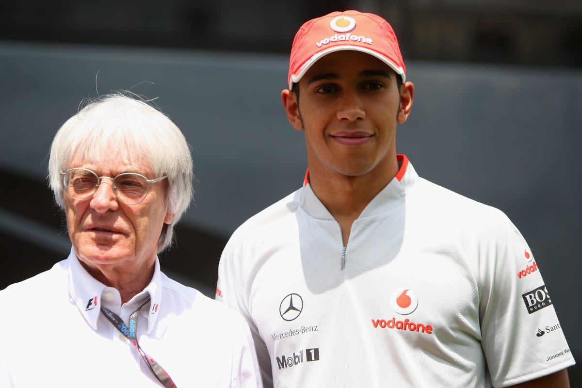 Ecclestone pictured with seven-time F1 world champion Lewis Hamilton (right) (Getty Images)