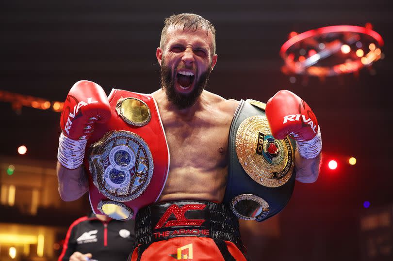 Photo shows Anthony Cacace with his belts