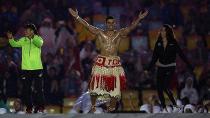 Look who’s back! Tongan flag bearer Pita Taufatofua jumps on stage during the Closing Ceremony. Pic: Getty