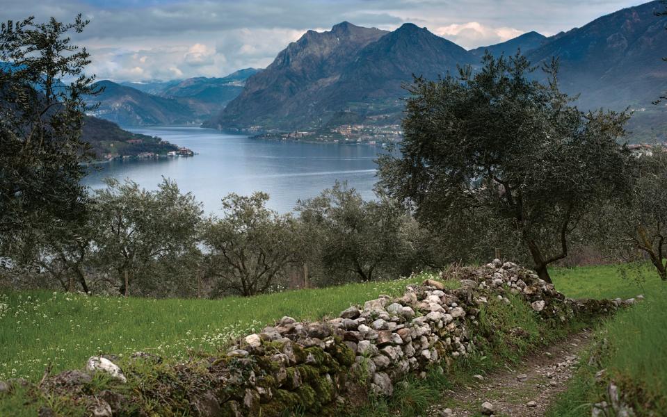 The Strada Valeriana stretches along the eastern shore of the lake, providing gorgeous lake views and flourishing hillside, Italian Lakes