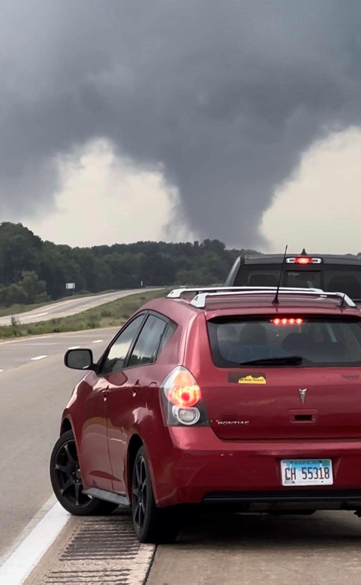 City officials said a tornado struck the city of Perry Friday night, Aug. 11, 2023. A funnel cloud is seen in this photo take by Owosso resident Bill Bouwman while driving home from Lansing on Interstate 69.