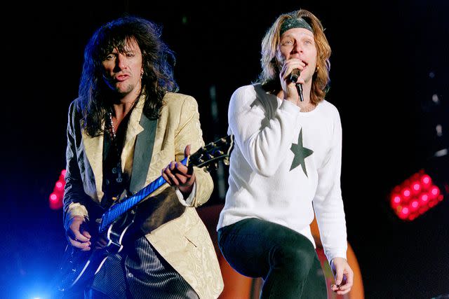 <p>Dave Hogan/Getty </p> Richie Sambora and Jon Bon Jovi performing in June 1995