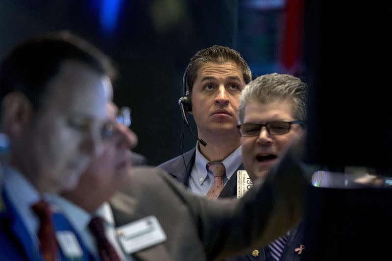 A trader works on the floor of the New York Stock Exchange January 23, 2015. REUTERS/Brendan McDermid