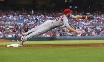 St. Louis Cardinals first baseman Paul Goldschmidt manages to just keep his foot on the bag for the out, taking the throw from third baseman Nolan Arenado on a grounder by Atlanta Braves' Matt Olson during the fourth inning of a baseball game Wednesday, July 6, 2022, in Atlanta. (Curtis Compton/Atlanta Journal-Constitution via AP)