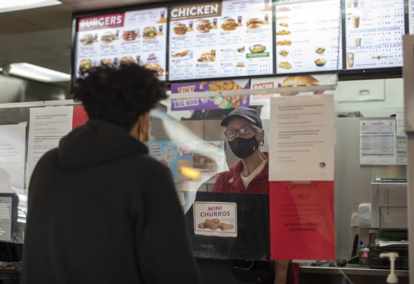 PALMDALE, CA - DECEMBER 16: Lori Castro works her shift at a Jack in the Box restaurant in Palmdale on Thursday, Dec. 16, 2021. She credits a Los Angeles Community Health Project program for helping her get sober after years of using methamphetamine. The program, Law Enforcement Assisted Diversion, provides case management as a way to stop people from cycling in and out of jail or tangling regularly with police. (Myung J. Chun / Los Angeles Times)