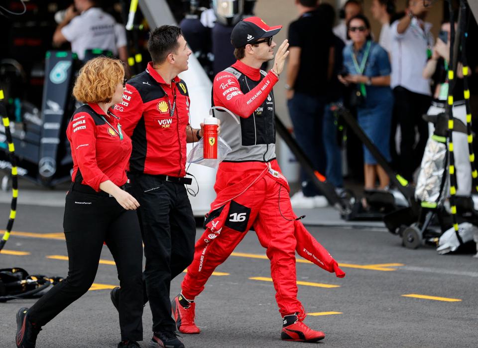 Charles Leclerc makes his way to the grid (REUTERS)