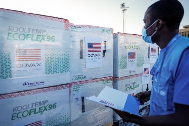 A UNICEF worker checks boxes of Moderna coronavirus vaccine after their arrival in Nairobi on Aug. 23 — the first time the Moderna drug has been received in Kenya. (Photo: via Associated Press)