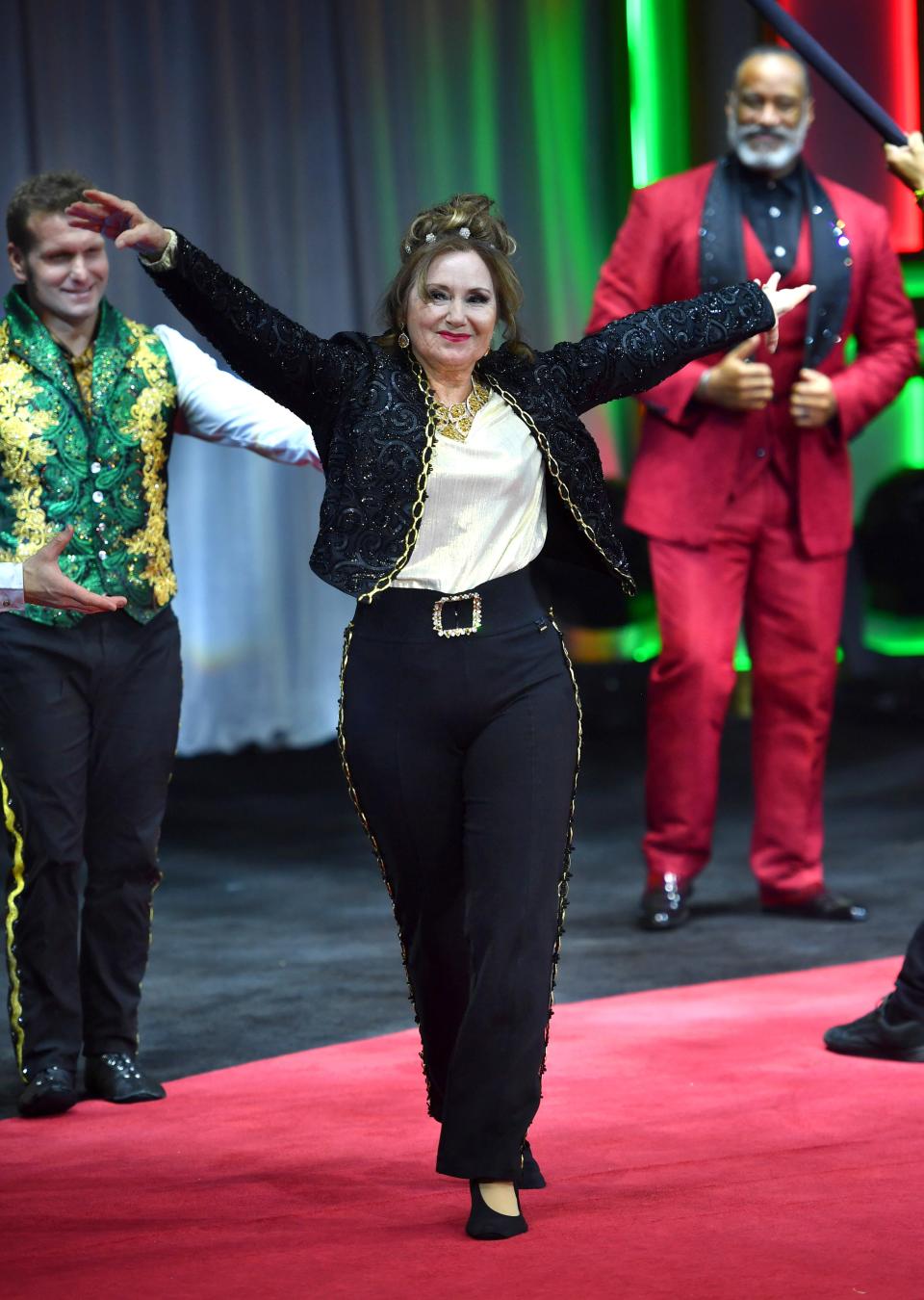 Delilah Wallenda, 71, receives applause from spectators after performing on the high wire with her nephew, Blake Wallenda, and son, Nik Wallenda, on Thursday night, Dec. 28, 2023, at the Circus Arts Conservatory "A Brave New Wonderland" show at University Town Center in Sarasota.