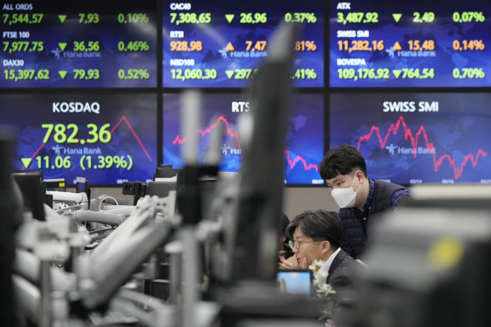 Currency traders watch monitors at the foreign exchange dealing room of the KEB Hana Bank headquarters in Seoul, South Korea, Wednesday, Feb. 22, 2023. Asian shares declined Wednesday after stocks tumbled on Wall Street as worries persist about higher interest rates and their tightening squeeze on the global economy. (AP Photo/Ahn Young-joon)