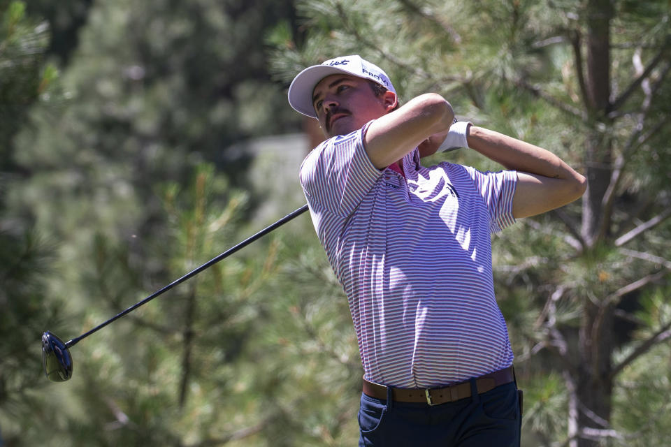 Carson Young watches a tee shot during the first round of the Barracuda Championship golf tournament at the Tahoe Mountain Club in Truckee, Calif., Thursday, July 20, 2023. (AP Photo/Tom R. Smedes)