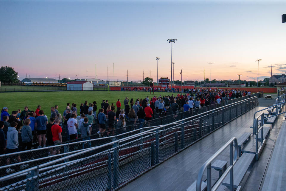 Hundreds gather at the Twin Lakes High School football field Wednesday night for a vigil honoring Kayvion Jackson, on June 8, 2022, in Monticello.