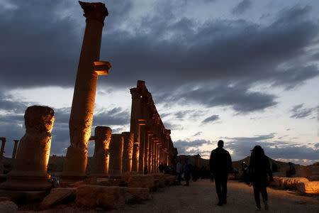 FILE PHOTO:People visit the ruins of the historic city of Palmyra ahead of a musical event at its amphitheatre, Syria May 6, 2016. REUTERS/Omar Sanadiki/File Photo